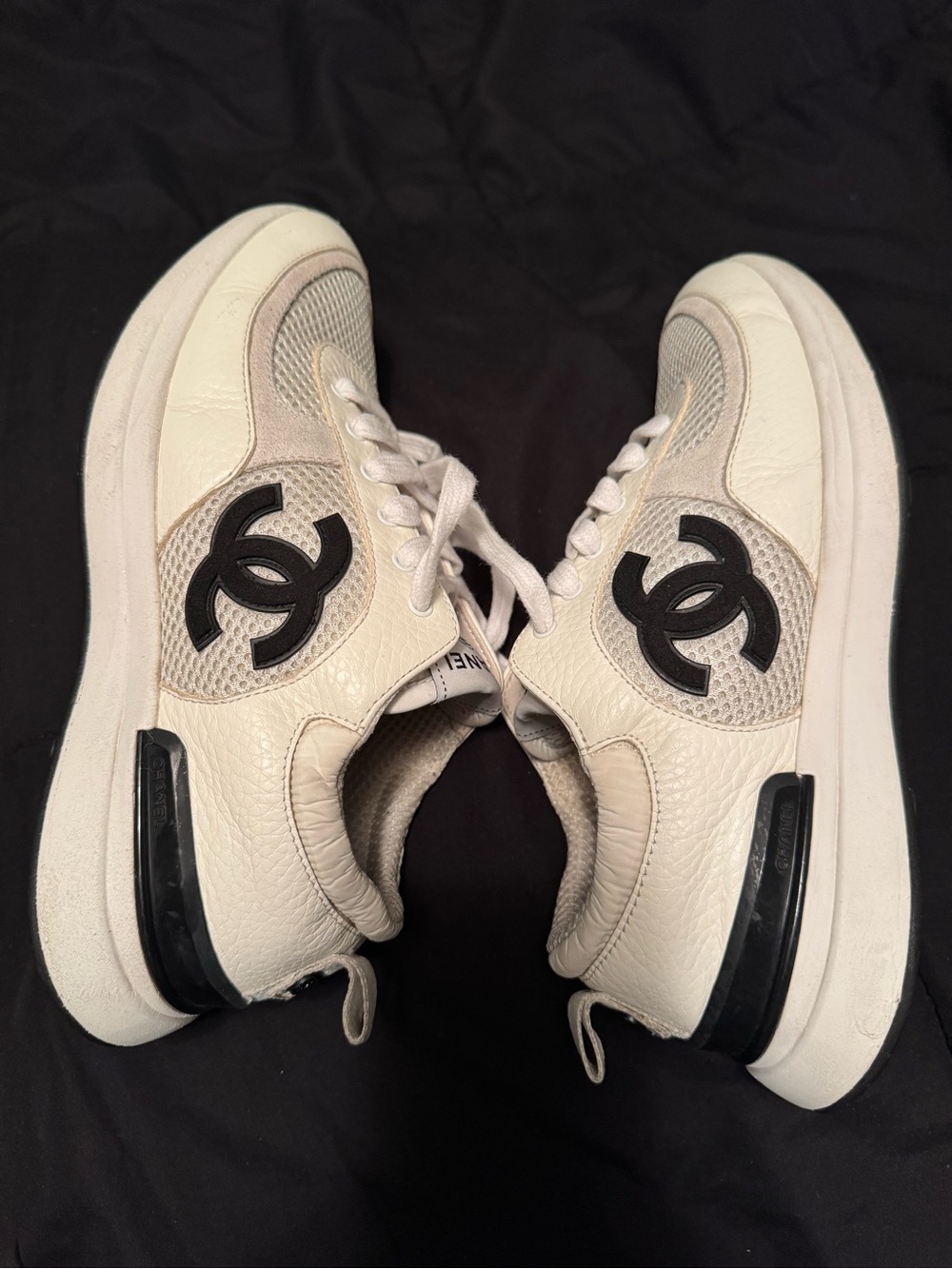 CHANEL Cream Leather Sneakers with Black CC Emblems